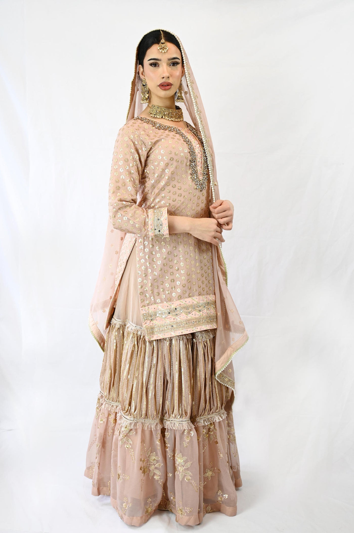 lehenga-suit-in-pink-ruffle-style-skirt